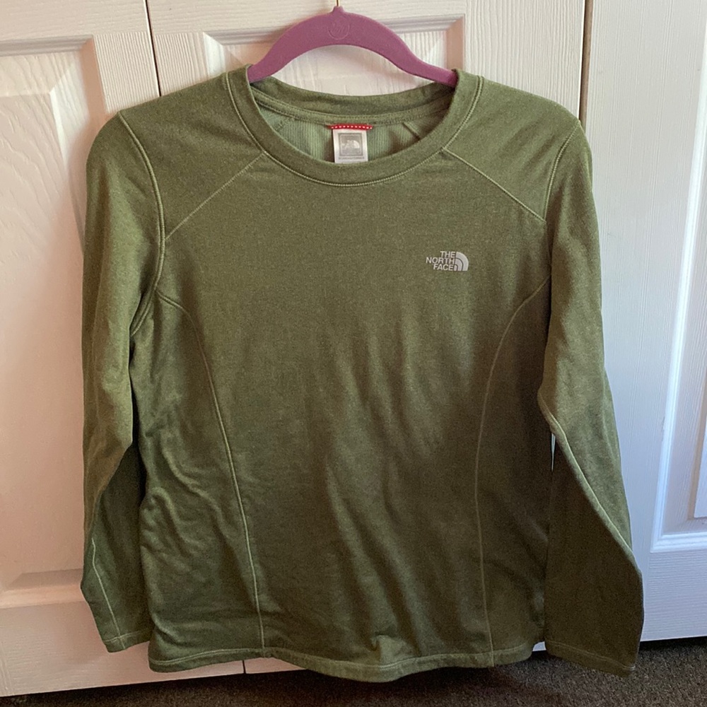 A green north face thermal shirt